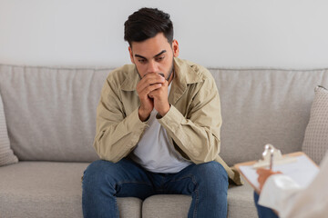 Man thoughtful during a counseling with therapist