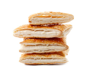 Stack of delicious fresh puff pastries isolated on white