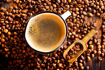 Coffee in cup on wooden table in cafe