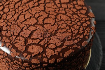 Delicious chocolate truffle cake on table, closeup