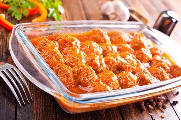 Meatballs in sweet and sour tomato sauce.