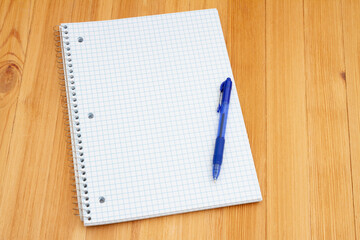Retro old lined graph paper notepad and pen on a desk - 786607580