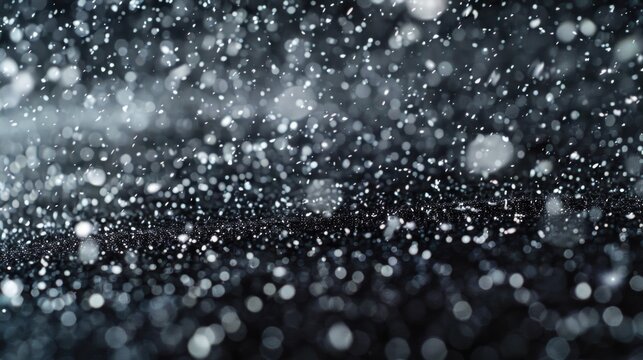 A serene black and white image of snow falling. Suitable for winter themes