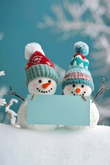 Snowmen couple holding sign, perfect for winter themes