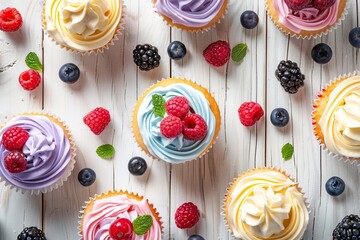 Tasty cupcakes with butter cream and ripe berries on wooden table. Flat lay - obrazy, fototapety, plakaty