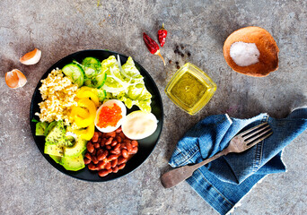 Buddha bowl, balanced food, vegetarian menu. Eggs, avocado, salad lettuce, bulgur, spice