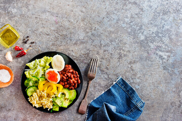 Buddha bowl, balanced food, vegetarian menu. Eggs, avocado, salad lettuce, bulgur, spice