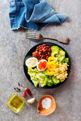 Buddha bowl, balanced food, vegetarian menu. Eggs, avocado, salad lettuce, bulgur, spice