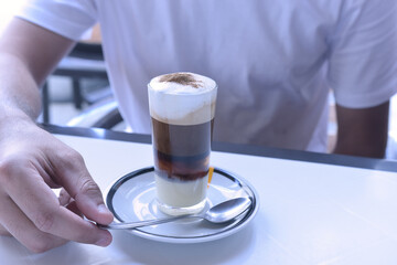 person holding a cup of coffee