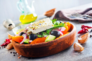 Greek salad of fresh cucumber, tomato, sweet pepper, lettuce, red onion, feta cheese and olives with olive oil. Healthy food, top view - 786628111