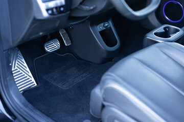 Electric car interior details. Vehicle Gas Brake Pedal, car pedals. Detailing of modern electric...