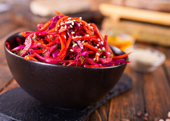 Fresh vegetable salad with sauerkraut cabbage, grated carrots and beetroots