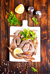 Uncooked Raw peeled tiger white shrimp prawn. wooden background. - 786634965