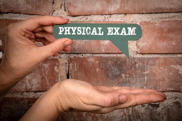 Physical Exam. Green speech bubble with text on a red brick background - 786635766