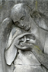 Fototapeta na wymiar Sculpture en pierre d'une vestale. Cimetière monumental, Milan - Italie