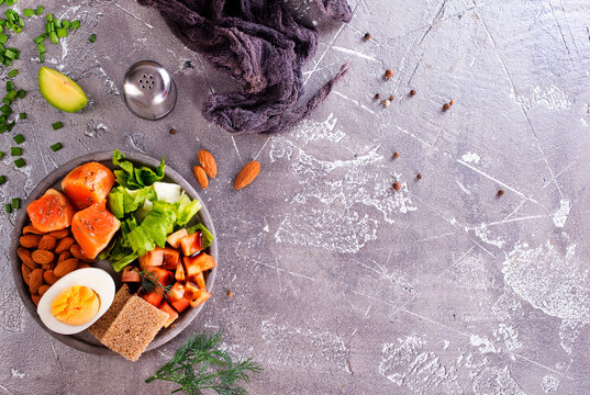 Salad With Salmon, Boiled Egg, Bean, Tomato, Salad And Almond Nuts.