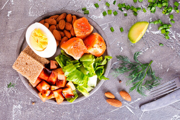 salad with salmon, boiled egg, bean, tomato, salad and almond nuts. - 786636718