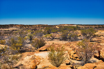 Fototapeta na wymiar Outback landscape at The Granites, close to Mount Magnet, Western Australia. This area strong has a strong cultural significance to the Aboriginal Badimia tribe 