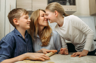 Woman and Two Children Making Cookies