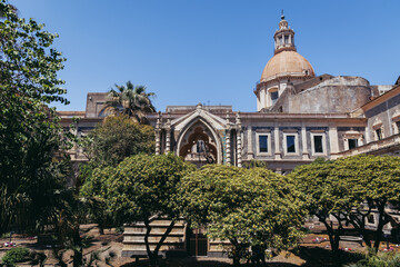 One of courtyard of University of Catania - Department of Human Sciences, former Benedictine monastery in Catania city on the island of Sicily, Italy - obrazy, fototapety, plakaty