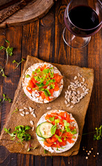 Tasty bruschetta with salmon. Salmon toast with cream cheese, arugula and sunflower seeds