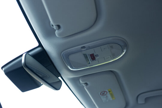 Emergency sos button to contact with call center to ask for help after car accident. SOS button in car as a symbol for the eCall system in European cars. Sos button on ceiling console in electric car.