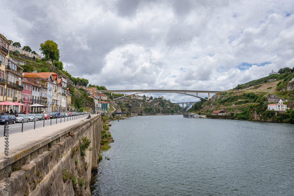 Sticker Gustavo Eiffel Avenue along bank of Douro River in Porto city, Portugal. View with Infante Dom Henrique Bridge