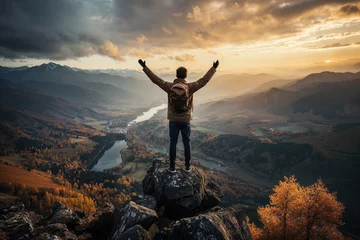 Foto op Canvas Man embracing nature on a mountain peak at sunset. Generative AI image © ADDICTIVE STOCK CORE