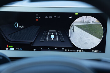 Electric car digital display panel. Close up of hybrid car instrument panel. Fully electric car...