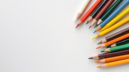 Fototapeta premium White background with colorful pencils and space for writing