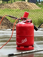  liquid gas cylinder with hose outdoors