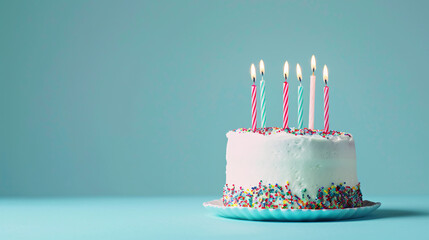 birthday cake with 6 candles on pastel blue background with copy space. Vanilla birthday confetti cake