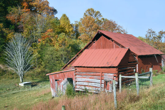 Log Barn With Faded Red Paint
