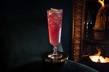 red drink on cocktail bar armchair