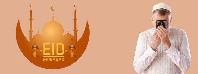Muslim man with Koran praying on beige background