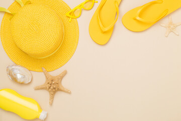Flat lay with yellow summer outfit on color background. Vacation concept