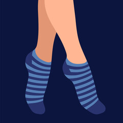 female legs in warm striped socks, isolated on a light background