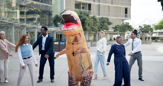 Business, people and dance outdoor in costume of fun inflatable dinosaur with happiness at office. Funny, group and crazy team building at workplace with comedy character in flossing movement