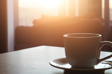 Morning Coffee Cup Mug on Living Room Table with Blur Background