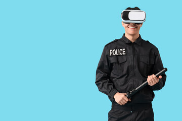 Male police officer in VR glasses with baton on blue background