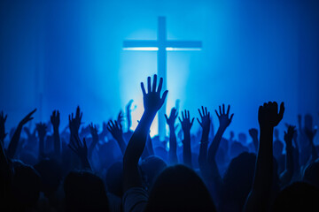 Christian worshipers raising hands up in the air in front of the cross