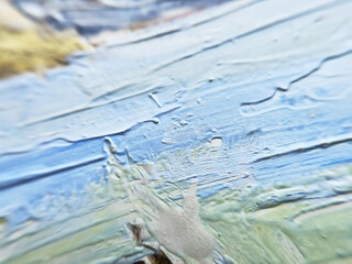 blue and turquoise brush strokes of oil paint on an artistic canvas close-up