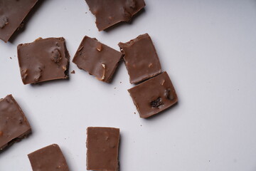 chocolate pieces on a white background