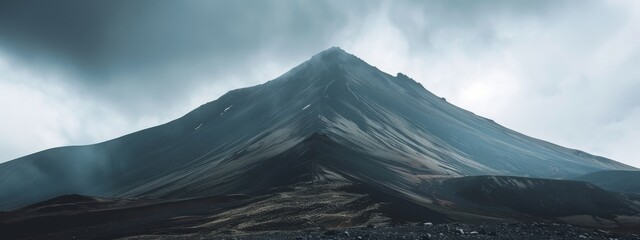 Majestic view of a dark, misty mountain, portraying the mystery and grandeur of nature's landscapes
