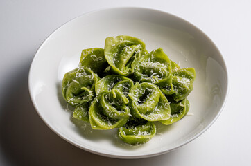 Pasta Bowl of green ravioli with parmesan