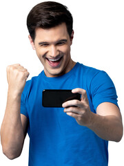 Handsome young male gamer clenching his fist with smiling face while playing game on mobile phone...