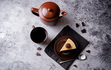Three chocolate cake in a plate with cup of tea - 786691149