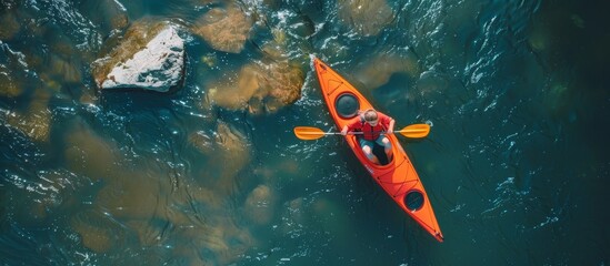 Aerial view of woman kayaking in stunning summer landscape, scenic stream adventure