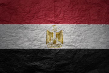 big national flag of egypt on a grunge old paper texture background