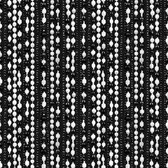 Threads of beads of black and white pearls. Seamless pattern.